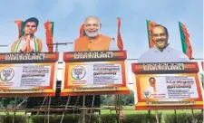  ?? P Vaidyanath­an Iyer ?? Cut-outs of Prime Minister Narendra Modi, Tamil Nadu BJP chief K Annamalai (left), and party candidate A C Shanmugam at Vellore Fort ground on Wednesday.