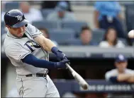  ?? KATHY WILLENS — AP ?? The Rays’ Travis d’Arnaud hits a solo homer in the first against the Yankees. MLB has seen a 19% rise in home runs this season.