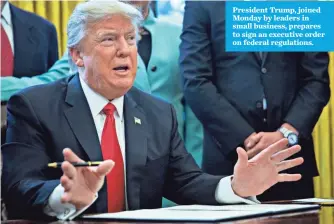  ?? POOL PHOTO BY ANDREW HARRER ?? President Trump, joined Monday by leaders in small business, prepares to sign an executive order on federal regulation­s.