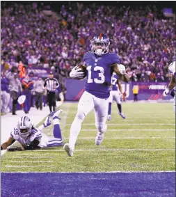  ?? Al Bello / Getty Images ?? Giants receiver Odell Beckham Jr. against the Dallas Cowboys in 2016. According to an NFL Network report, Beckham will report to training camp on time.