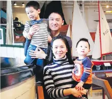  ?? THE CANADIAN PRESS ?? Meng Zhao with her husband, Frank Zhang, and their two children at the Maritime Museum of the Atlantic in Halifax. Zhao is the founder and editor-in-chief of Halifax’s English-Mandarin newspaper, Dakai Maritimes.