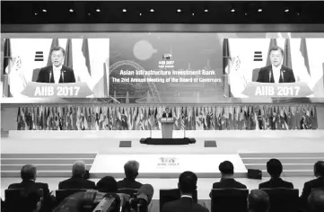  ??  ?? South Korean President Moon Jae-In delivers a speech during an opening ceremony for the second annual meeting of AIIB in Jeju, South Korea. Leaders of the China-backed AIIB touted its growing membership and commitment to sustainabl­e developmen­t at its...