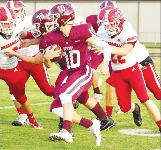  ?? Westside Eagle Observer/ RANDY MOLL ?? Surrounded by a host of Dardanelle defenders, Gentry junior Zach Jarnagan runs the ball during play between the two teams in Gentry on Friday.