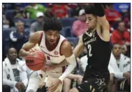  ?? (NWA Democrat-Gazette/Charlie Kaijo) ?? Arkansas’ Isaiah Joe (left), a 6-5 guard from Fort Smith Northside who averaged 16.9 points last season, has more time to ponder his future with the NBA Draft delayed until October.