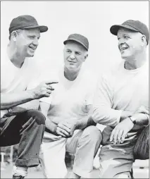  ??  ?? Paddy Driscoll, right, chats with Otto Graham, left, and Steve Van Buren. All three were announced as new members of the Pro Football Hall of Fame on Jan. 19, 1965. [AP FILE PHOTO]