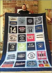  ??  ?? Before heading off to Alvernia, Pottstown High School graduate Aidan Owens received a quilted gift to remind him always of his Pottstown Pride.