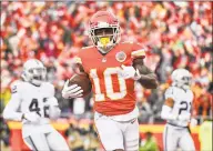  ?? John Sleezer / TNS ?? Kansas City Chiefs wide receiver Tyreek Hill trots into the end zone to score against the Oakland Raiders on Dec. 30 at Arrowhead Stadium in Kansas City, Mo.