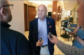  ?? LM OTERO — THE ASSOCIATED PRESS ?? Clemson University President Jim Clements listens to a reporter’s question after the College Football Playoff presidents group meeting Tuesday in Grapevine, Texas. The CFP met to discuss a proposed plan to expand the postseason format from four to 12teams.