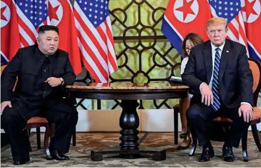  ?? AFP ?? Kim Jong-un and Donald Trump hold a meeting during the second US-North Korea summit at the Sofitel Legend Metropole hotel in Hanoi on Thursday. —