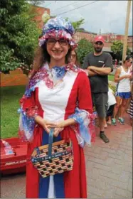  ??  ?? Sierra Rechak of Schuylervi­lle in patriotic garb at the 10th annual Saratoga’s All-American Celebratio­n on Tuesday in downtown Saratoga Springs.