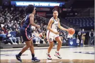  ?? Jessica Hill / Associated Press ?? UConn’s Azzi Fudd, right, dribbles as Christyn Williams defends during First Night events for the men’s and women’s Oct. 15.