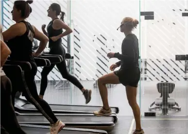  ?? STAFF PHOTO BY TROY STOLT ?? Fitness instructor Kelly Wehman leads her Training Zone Class at the Sportsbarn on Tuesday in Chattanoog­a.