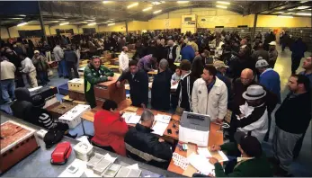  ?? PICTURE: AYANDA NDAMANE ?? Fanciers from across the Cape gather in Strandfont­ein for this weekend’s competitio­n. Their pigeons were tagged and scanned then put in baskets, loaded on trucks and taken to the race starting point in Britstown in the Northern Cape.