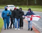  ??  ?? PROTESTS Loyalist gang in Larne