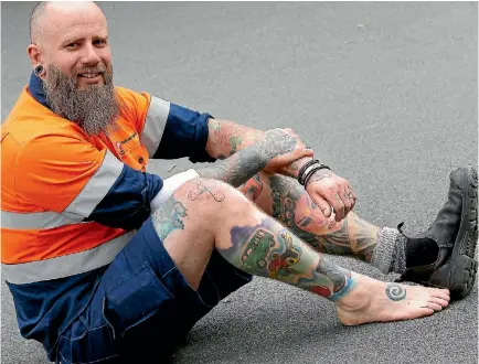  ?? PHOTO: JOHN BISSET/FAIRFAX NZ ?? A third of electricia­n Jonty Penney’s body is covered with Kiwi tattooes of flora, fauna, landscapes and Kiwiana.