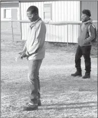  ??  ?? Rockets: Strong High School students Jedarius Dixon and Dezmond Newton study the distance and angles of the rockets they made in Cathy Barton’s physics class.