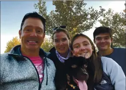  ?? COURTESY OF THE LOWRY FAMILY ?? From left, father Will Lowry and mother Katherine Lowry are with their children, Kaitlin, 13, and Liam, 15, and the family dog, Jack, in Utah. Will Lowry moved to the Salt Lake City area with his soccer-loving children so they could continue playing outside Santa Clara County’s shutdown.