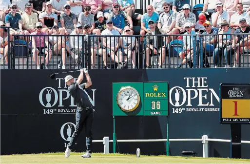  ?? PETER MORRISON THE ASSOCIATED PRESS ?? Dundas’s Mackenzie Hughes plays his shot from the first tee during the final round of the Open Championsh­ip at Royal St George's in Sandwich, England, Sunday.