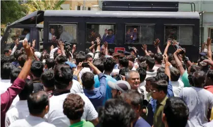  ?? Photograph: Amit Dave/Reuters ?? A police van transports some of those convicted in 2016 in connection with the Gujarat communal riots.