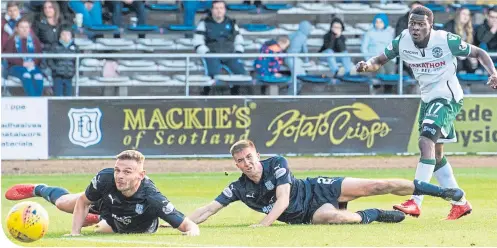  ??  ?? Hibs’ Thomas Agyepong fires home to make it 3-0 to the visitors