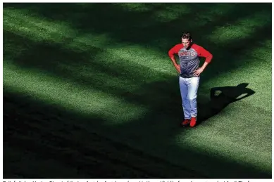  ?? SEAN M. HAFFEY / GETTY IMAGES 2017 ?? Relief pitcher Huston Street of the Los Angeles Angels works out in the outfield before a home game last April. The former Longhorns star is 99 percent sure he will retire — unless a winning team needs midseason help.