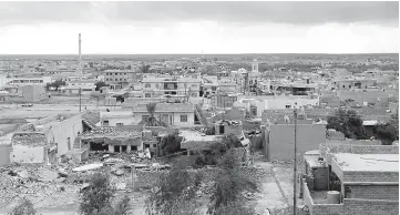  ??  ?? A general view shows the town of Bashiqa, some 20 kilometres north east of Mosul. — AFP photo