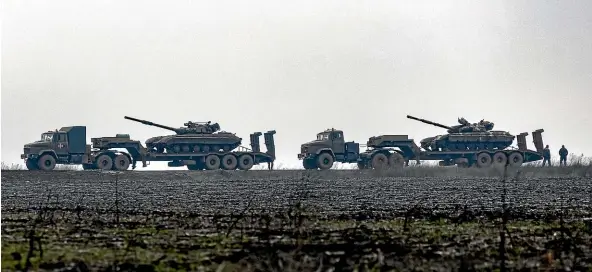  ?? AP ?? Ukrainian tanks are transporte­d towards to the country’s front-line Luhansk region. Ukraine’s military is not regarded as a match for Russia’s.
