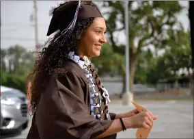  ?? RECORDER PHOTOS BY ALEXIS ESPINOZA ?? Sylvana Beltran heads to the diploma table at the Butterfiel­d Charter School gradu tion ceremony on Friday evening.