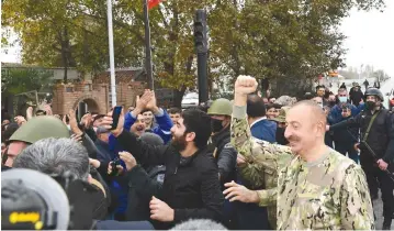  ??  ?? AZERBAIJAN’S PRESIDENT Ilham Aliyev greets supporters as he visits the Fuzuli and Jabrayil districts in the region of Nagorno- Karabakh last week. ( Official web- site of President of Azerbaijan/ Reuters)