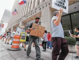  ?? Steve Gonzales / Houston Chronicle ?? Protesters in front of the Houston Police Department headquarte­rs downtown on Saturday voiced concerns over Senate Bill 4, which will go into effect on Sept. 1.