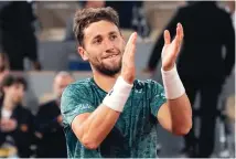  ?? MICHEL EULER/ASSOCIATED PRESS ?? Norway’s Casper Ruud applauds after defeating Croatia’s Marin Ciloc in their semifinal match on Friday at Roland Garros stadium. Up next is Rafael Nadal.