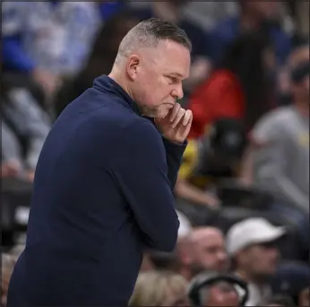  ?? AARON ONTIVEROZ — THE DENVER POST ?? Nuggets head coach Michael Malone works the sidelines during the second quarter at Ball Arena in Denver on Monday.