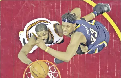  ??  ?? CLEVELAND: Cleveland Cavaliers’ Tristan Thompson (left) drives to the basket against Indiana Pacers’ Myles Turner in the first half in Game 2 of a first-round NBA basketball playoff series, on Monday, April 17, 2017. — AP