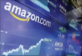  ?? FILE PHOTO - ASSOCIATED PRESS ?? The Amazon logo is displayed at the Nasdaq MarketSite, in New York’s Times Square. Amazon announced Thursday, Sept. 7, that it has opened the search for a second headquarte­rs, promising to spend more than $5 billion on the opening.