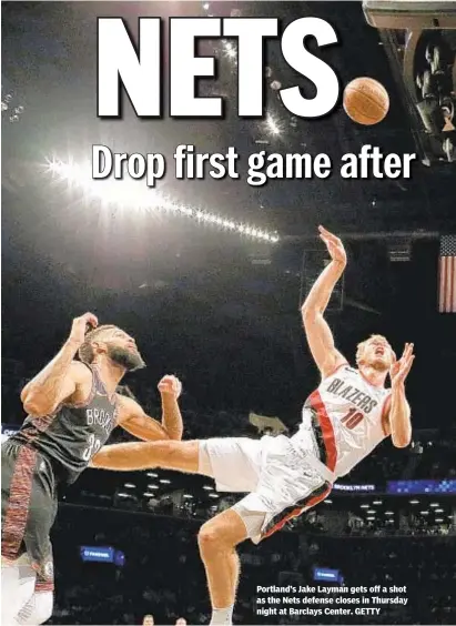  ?? GETTY ?? Portland’s Jake Layman gets off a shot as the Nets defense closes in Thursday night at Barclays Center.