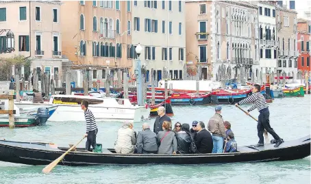  ?? RICK STEVES ?? In Venice, only three “traghetti” still ferry tourists across the Grand Canal from establishe­d stops.