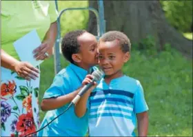  ?? MARIAN DENNIS – DIGITAL FIRST MEDIA ?? Josiah Jackson, 5, and Evan Jackson, 4, sing a rendition of “Jesus Loves Me” for the crowd at Riverfront Park Saturday during the Stop the Drugs Stop the Violence Crusade.
