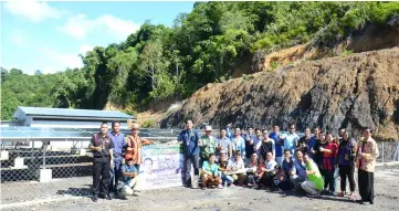  ??  ?? Dennis (standing, fourth left) with the rural residents of Long Itam, Ulu Baram after launching the Sares project at the longhouse yesterday.