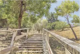  ?? ?? THE STAIRS on the steep Eldred Street in Mt. Washington are part of the Southwest Museum walk, above. The Saroyan Stairs, pictured below, were built of granite in 1923 and declared a historic-cultural monument by the city of L.A. in 1991. The view along the Hollywood Bowl-High Tower loop, middle. A zig-zagging staircase on Avenue 43 on the Mt. Washington walk route, bottom.