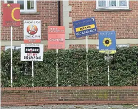  ?? /Reuters ?? Price stress: Property sale and rental signs in London. Even people in their 70s are requesting rent discounts in exchange for work, according to Andrea Frankentha­l, founder of Hapipod.