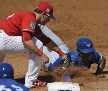  ?? CHRIS O’MEARA/THE ASSOCIATED PRESS ?? Melvin Upton, getting back to first safely in the Jays’ 6-4 win over Philadelph­ia on Thursday, has no trouble stealing bases. But getting to first has been an issue for the outfielder who hit .196 with the Jays last year.