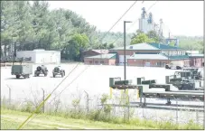  ?? RICK PECK/SPECIAL TO MCDONALD COUNTY PRESS ?? A parking lot for Missouri National Guard equipment is now home for what once was the ballpark for the city of Anderson.