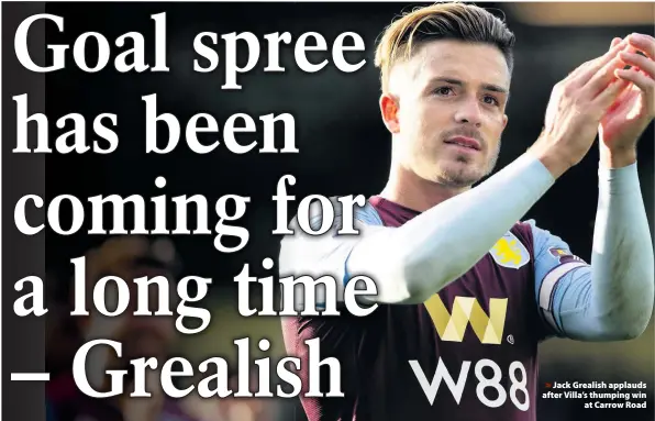  ??  ?? > Jack Grealish applauds after Villa’s thumping win
at Carrow Road