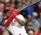  ?? PAUL VERNON / AP ?? Aristides Aquino watches his home run against the Cubs during the sixth inning.