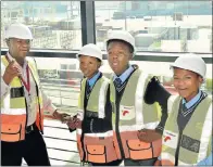  ??  ?? LEARNING MORE: David Gwabeni at the Port of Ngqura with three pupils from Douglas Mbopa High School in Motherwell. From left are Olwethu Tshangda, 16, Masixole Nkasayi, 15, and Gqomfa Babalo, 16 Picture: MIKE HOLMES