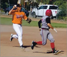  ?? PHOTOS BY BOB MINENNA ?? Kelseyvill­e shortstop Zayne Barker chases Clear Lake’s Ryan Ollenberge­r during a rundown in the top of the first inning. He was eventually tagged out.