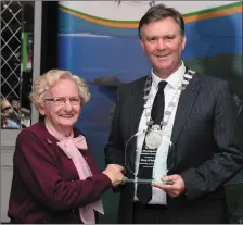  ?? Graham Spring presents a prize to Mary O’Brien from Tralee. Photos ??