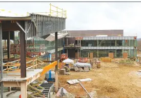  ?? (NWA Democrat-Gazette/David Gottschalk) ?? The addition will nearly double the size of the 88,000-square-foot library.