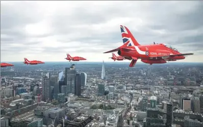  ?? MOD VIA REUTERS IRAN ?? Members of the Red Arrows Aerobatic Team fly over London, heading for Buckingham Palace, as part of the celebratio­ns for the centenary of the Royal Air Force, on Tuesday.