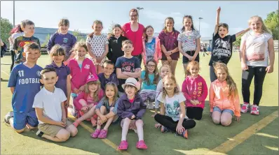  ??  ?? Some of the many youngsters who enjoy using the artificial pitch.